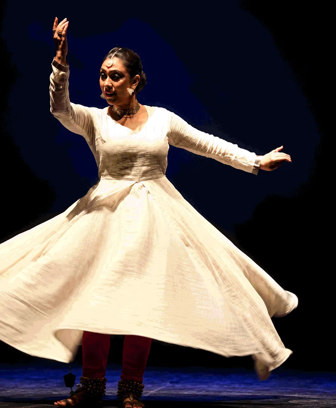 Classical dancer spinning in a white dress